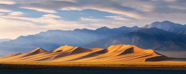 Canvas Print - Majestic sand dunes at sunrise beneath dramatic cloudy sky and mountain range