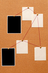 Fototapete - Blank paper notes and an empty photo are pinned to a cork board. The concept of detective investigation.