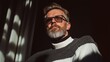 © BleizerShtorn - Stylish Bearded Man in Sunglasses Relaxing in Sunlight, Confident Mature Male in Elegant Outfit with Moody Shadows, Modern Sophistication and Timeless Fashion