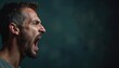 © miss irine - Side profile close-up of man with open mouth yells intensely against dark moody background. Detailed capture facial features, emotion, strong voice. Expressive character shouts with power. Sharpened