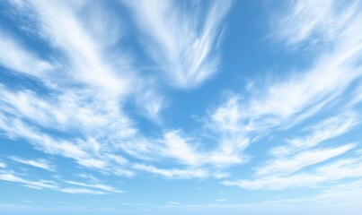 Wall Mural - The sky is blue and clear with a few clouds scattered throughout