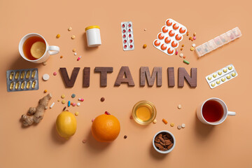 Wall Mural - Composition with word VITAMIN made of wooden letters, pills, citrus fruits, tea and honey on color background. Immunity boosting concept