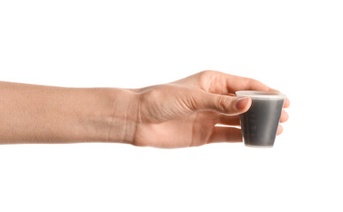 Poster - Female hand with measuring cup of cough syrup on white background