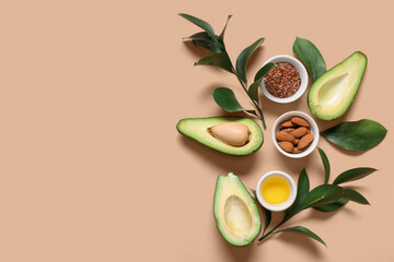 Wall Mural - Composition with ripe avocado, oil, flax seeds and plant branches on color background