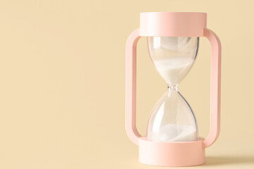 Wall Mural - Hourglass on beige background. Time management concept