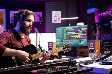 Poster - Professional artist teaching guitar lessons on social media web channel, recording himself playing musical instrument accords and explaining strings notes. Young songwriter making tutorials.
