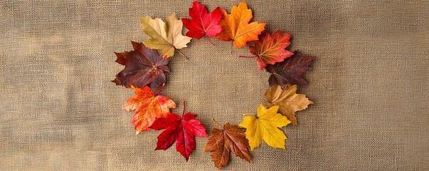 Aufkleber - Circle of colorful autumn maple leaves arranged on a burlap background, creating a beautiful fall-themed image