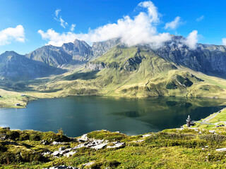 Wall Mural - The alpine lake Melchsee or Melch Lake in the Uri Alps mountain massif, Kerns - Canton of Obwalden, Switzerland (Kanton Obwald, Schweiz)