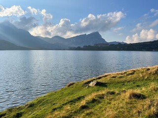 Wall Mural - The alpine lake Melchsee or Melch Lake in the Uri Alps mountain massif, Kerns - Canton of Obwalden, Switzerland (Kanton Obwald, Schweiz)