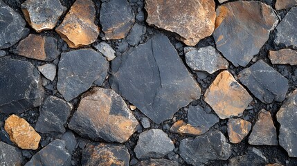 Poster - Close-up view of a stone wall. Various shades of grey and brown rocks create a textured surface. Macro Texture Backgrounds. Dark and Light Stone Wall Texture