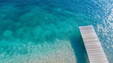 Aufkleber - Aerial view of a beautiful wooden dock extending over clear blue water at a tropical beach : Generative AI