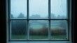© jiraporn - Foggy View Through a Window With Rain and Trees in the Distance