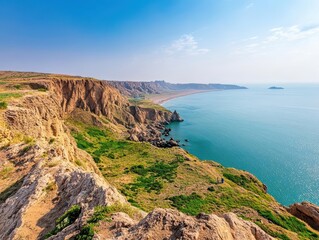 Poster - Scenic coastline of oman featuring rocky cliffs and calm turquoise waters under a clear blue sky