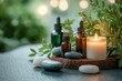 © zhuan - spa beauty treatment items with essential oils massage stones sea salt candle green plant on wooden table