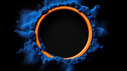 Poster - Vibrant Orange Circle Framed by Blue Dust Against Black Background