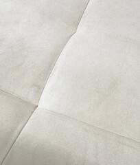 Wall Mural - A white couch with a tan cover