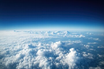 Wall Mural - aerial view cloudscape, high-altitude flight, blue sky, sunrise, atmospheric perspective, travel bac
