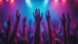 © Kaizenart - Crowd with raised hands enjoying a vibrant concert under colorful stage lights at night