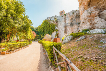 Wall Mural - Greek theatre at Archaeological Park of Syracuse Sicily in the Neapolis archaeological park, Italy. Ear of Dionysius