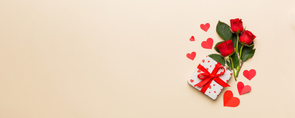 Wall Mural - Valentine's day composition with rose flower, red heart and gift boxes on table. mother day and birthday greeting, copy space, top view