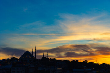 Wall Mural - ramadan or islamic concept photo. silhouette of mosque with dramatic sky