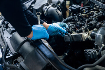 Poster - Serviceman repair car in car service