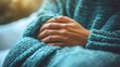 © Nawarit - Mental health, close-up of hands in a comforting gesture, warm environment