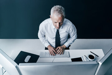 Aufkleber - Man, computer and office for budget review, digital proposal and chief financial officer. Mature person, company audit and monitor investment revenue, shares value and website for economy trend