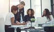 © JamDay/peopleimages.com - Planning, finance or business people in meeting with project for feedback, discussion or teamwork. Corporate report, writing or financial advisor talking to economists for economic analysis together
