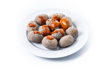 Wall Mural - Papas arrugadas with mojo sauce isolated on white background. Traditional Canary Islands food.