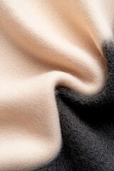 Poster - A soft-focus wool surface transitions from a light beige to rich black, creating a striking gradient. This contemporary textile embodies a sophisticated fashion style