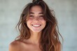 © He - young woman with radiant smile topless long curly brown hair