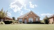 © tugkiara - Suburban brick house, sunny day, landscaped yard.  Real estate listing image