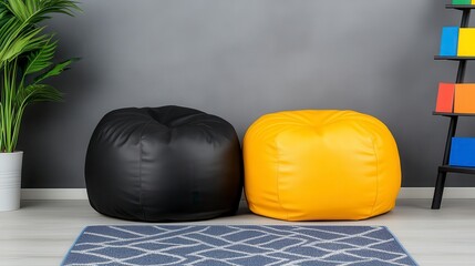 Wall Mural - Two modern beanbag chairs, black and mustard yellow, sit on a patterned rug in a room with gray walls. A plant sits in a pot in the foreground. The