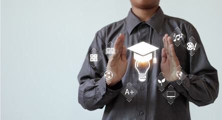 Wall Mural - A person in a formal dress shirt presents a glowing education concept, with icons representing both academic and extracurricular subjects.