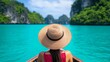 © fotogurme - Asian American traveler wearing a sunhat relaxing on a wooden boat cruising through turquoise waters tropical paradise getaway