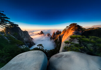 Poster - Chinese mountain landscape at dawn, with peaks rising above the clouds, bathed in soft sunlight and vibrant sky in China. Serene and breathtaking view.