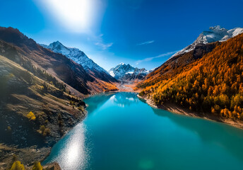 Poster - A stunning landscape in China showcases a vibrant turquoise lake nestled between majestic mountains adorned with autumn colors under a clear, sunny sky.