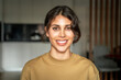 © Stock 4 You - Headshot closeup portrait of young smiling latin freelance businesswoman, entrepreneur coder programmer working, studying remotely from home. Indian or middle eastern student woman looking at camera