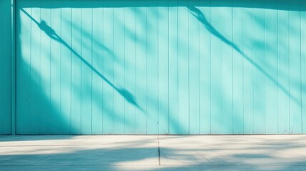 Poster - A smooth turquoise wall interacts captivatingly with natural light, producing intricate shadows that enrich visual interest. The minimalist approach enhances artistic expression.