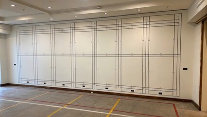 Aufkleber - An image featuring an empty wall with outlined markings for multiple recesses illustrating the precise planning required to maintain aesthetic appeal.