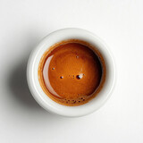 Top down view of strong espresso shot in white cup with copy space for cafe design