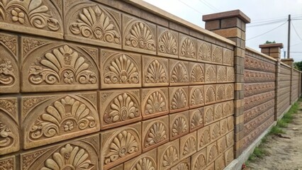 Poster - Detailed image of a stamped concrete wall displaying ornate patterns resembling traditional brickwork with varying shades of earthy tones highlighting the intricate design.