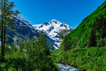 Alaska wilderness with snowcapped mountains, rivers and lakes