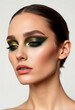 © Semiase - A captivating close-up portrait showcasing bold green and gold eye makeup, sharp eyeliner application, and a polished, sophisticated appearance. Ideal for beauty and fashion-related themes or concepts