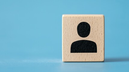Poster - Wooden block with a human figure icon on a blue background, symbolizing identity, community, and personalization.