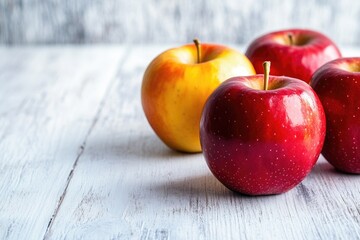 Poster - A basket of juicy red apples placed on a wooden table, ideal for still life photography or food related concepts