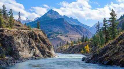 Wall Mural - Mountainous terrain with rugged peaks and scenic riverbanks