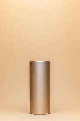 Wall Mural - Sleek cylindrical object stands against warm, neutral background