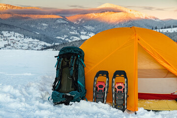 overnight in a tent in the mountains in winter, camping equipment.